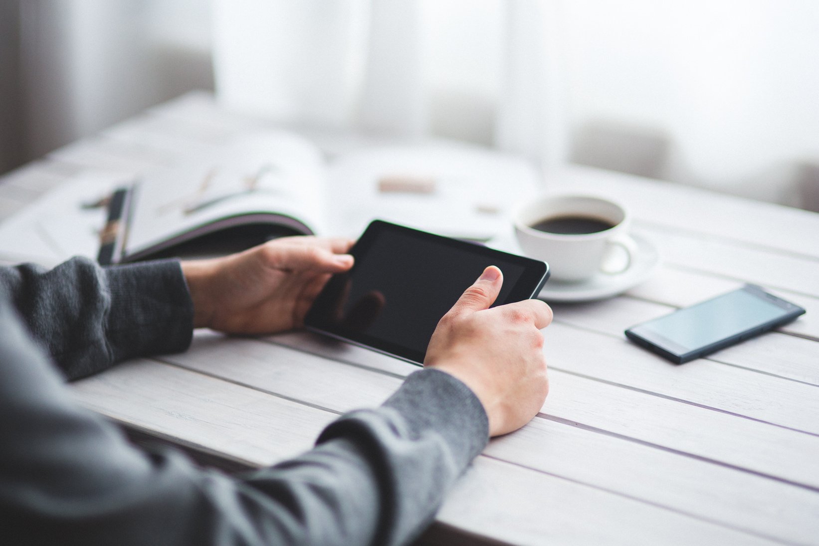 Man holds digital tablet  in his hands